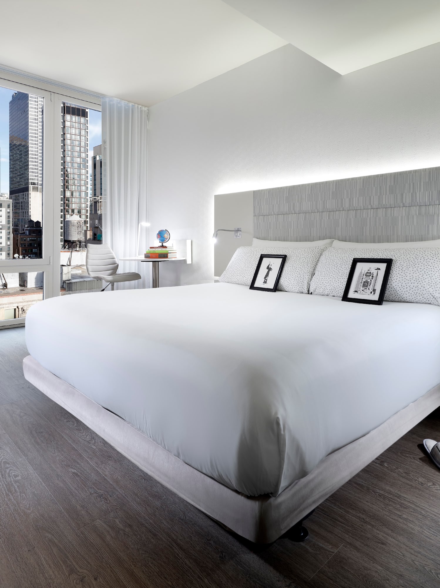 a bedroom with a large bed and a window