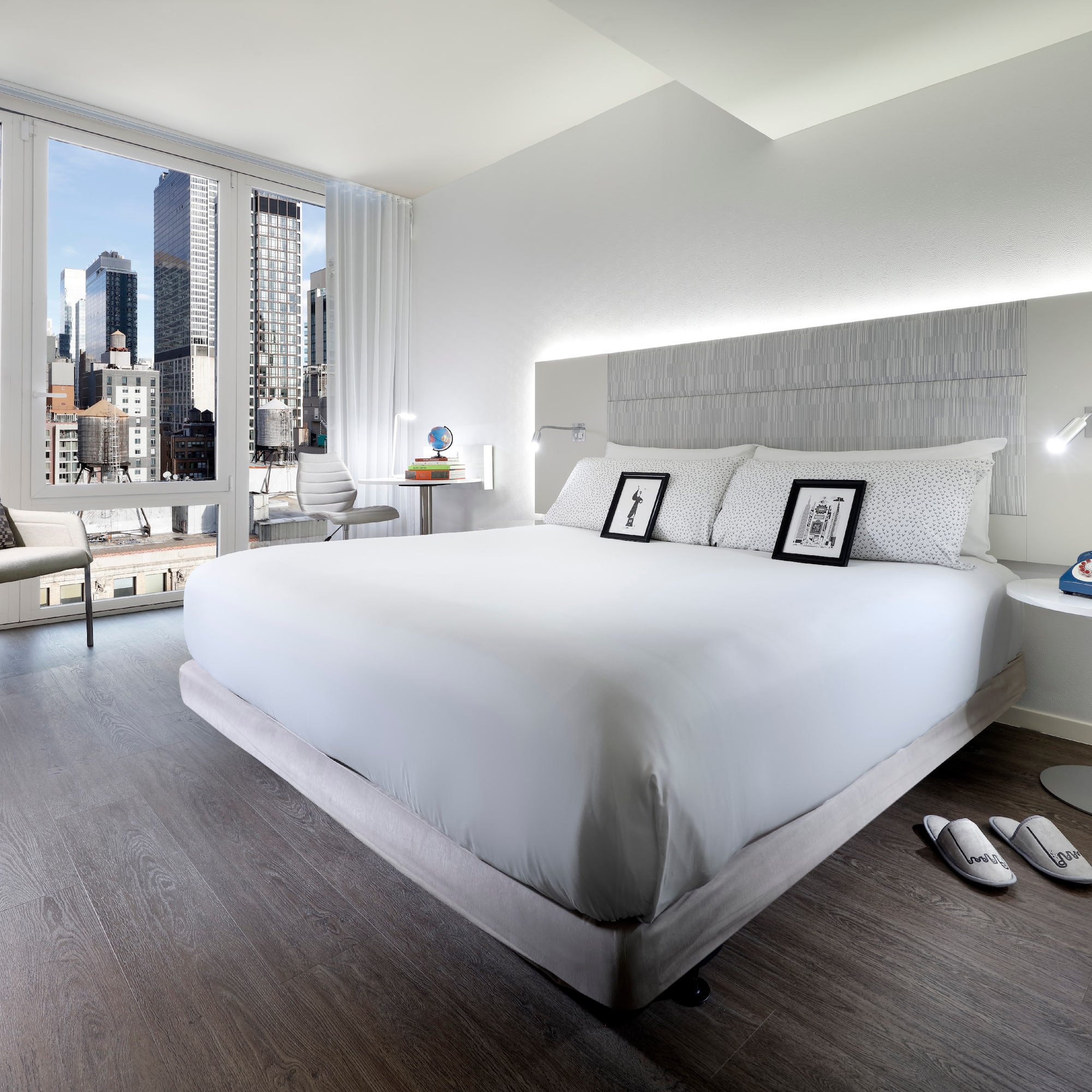 a bedroom with a large bed and a window