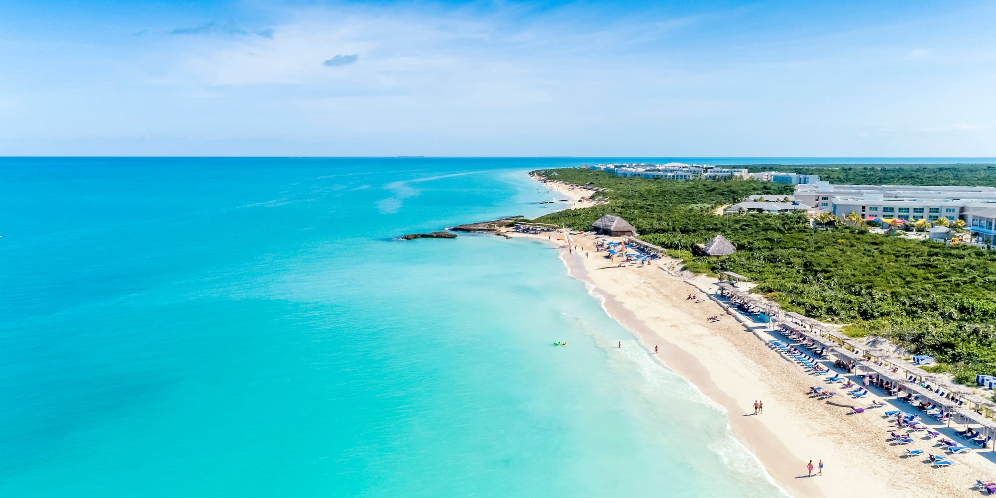 a beach with people on it