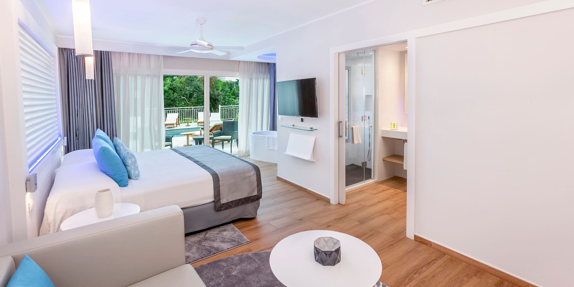 a bedroom with a bed and a television