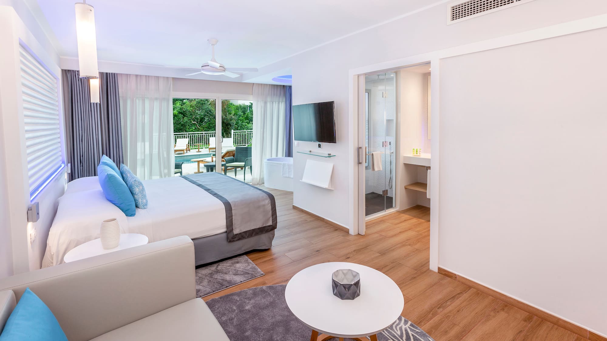 a bedroom with a bed and a television