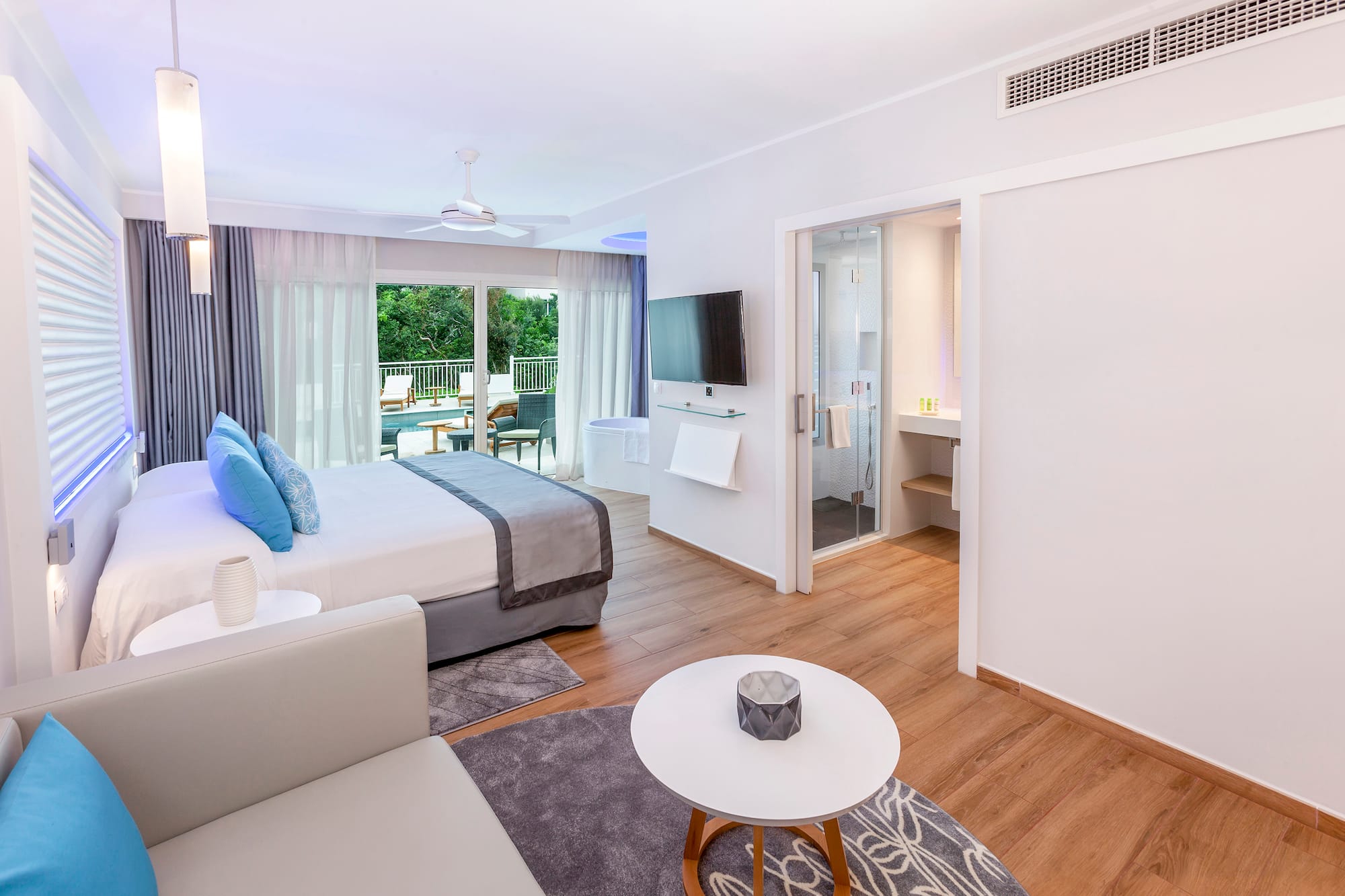 a bedroom with a bed and a television