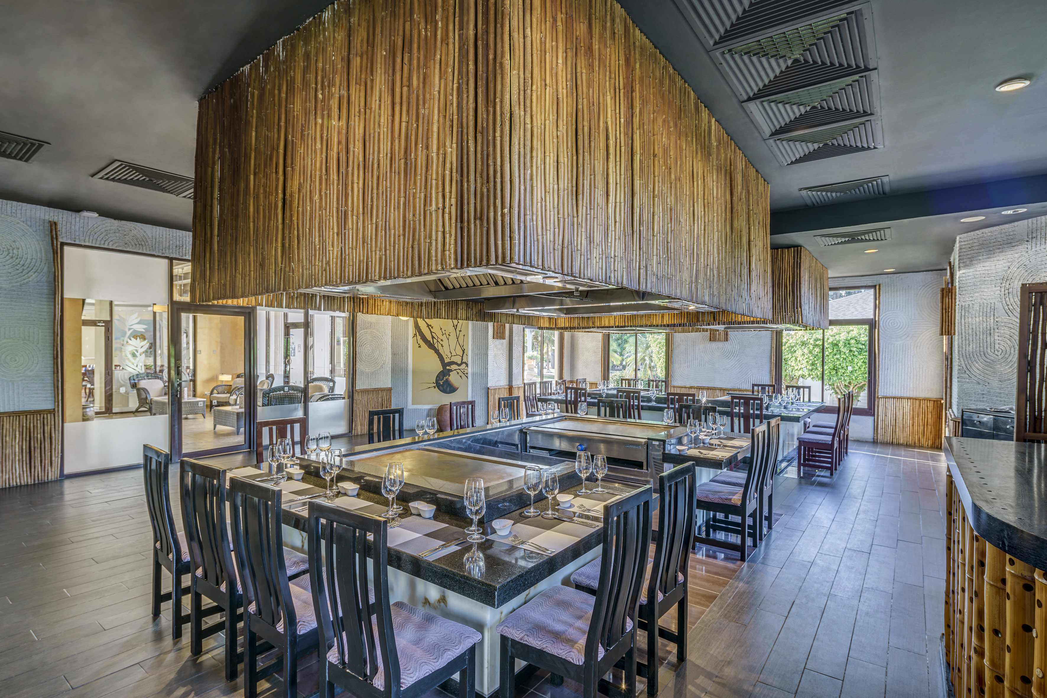 a restaurant with a large table and chairs