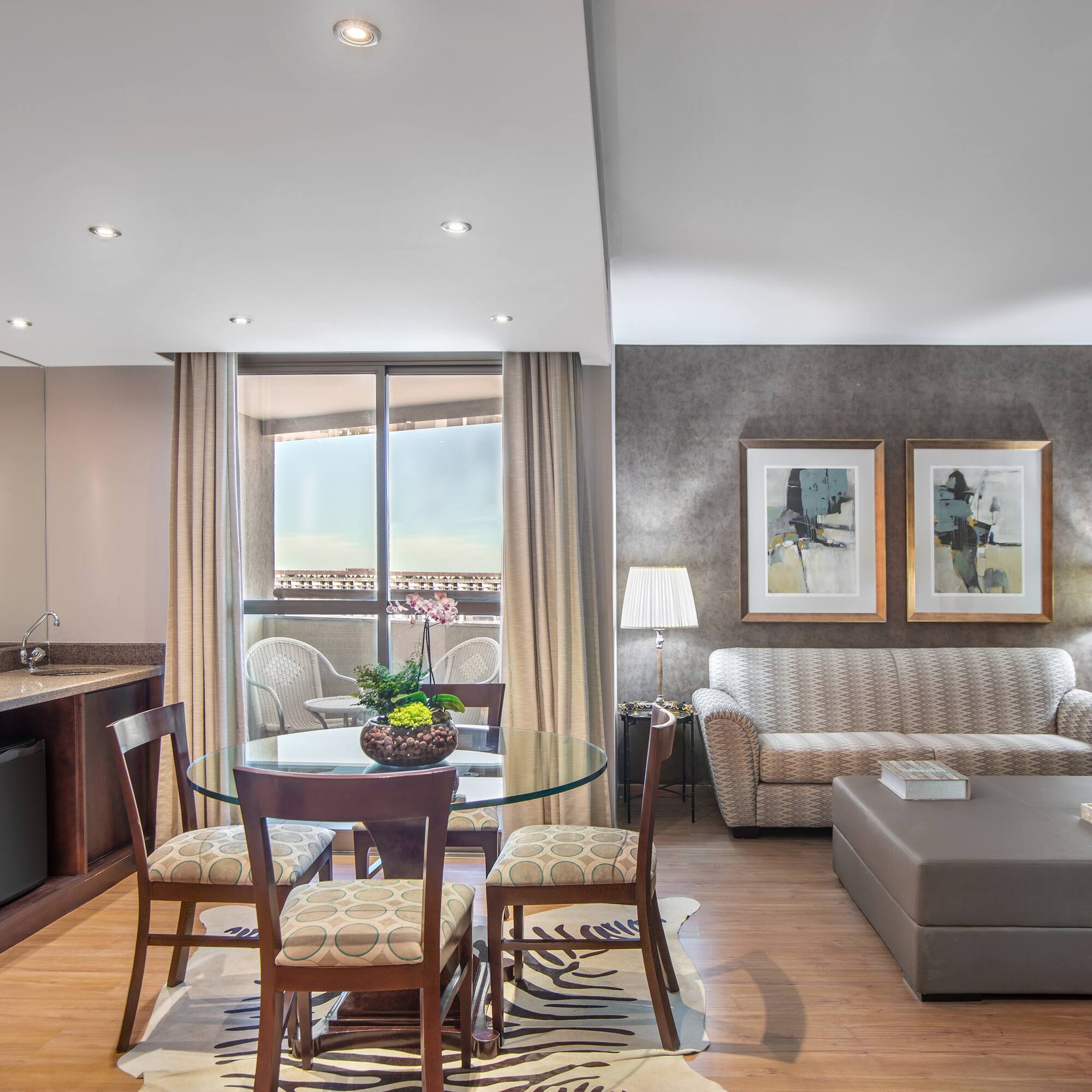 a living room with a table and chairs