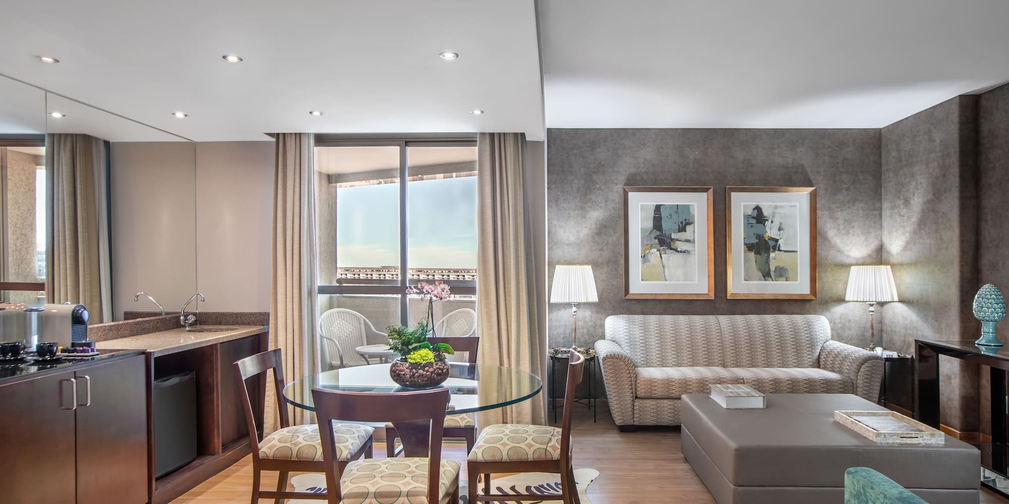 a living room with a table and chairs