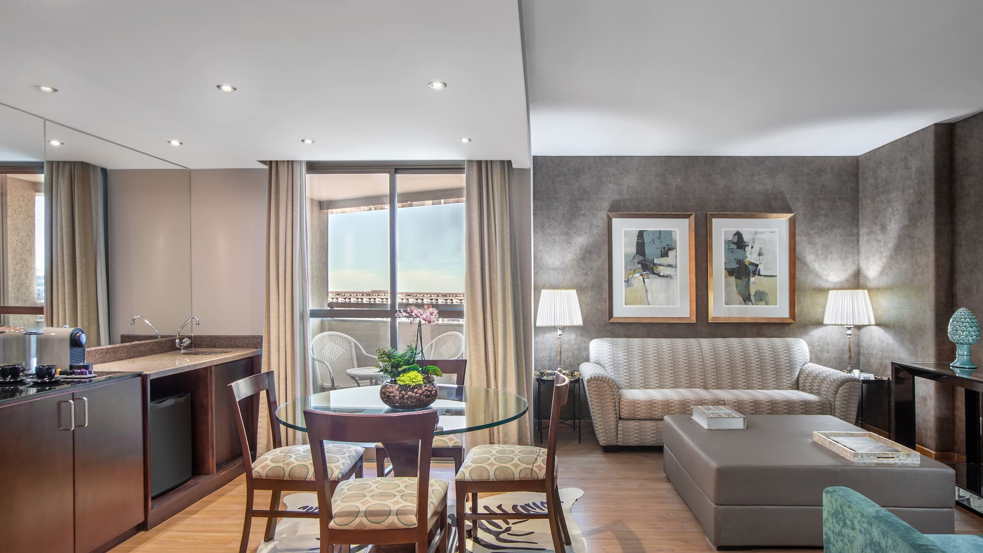 a living room with a table and chairs