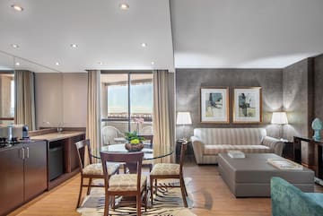 a living room with a table and chairs