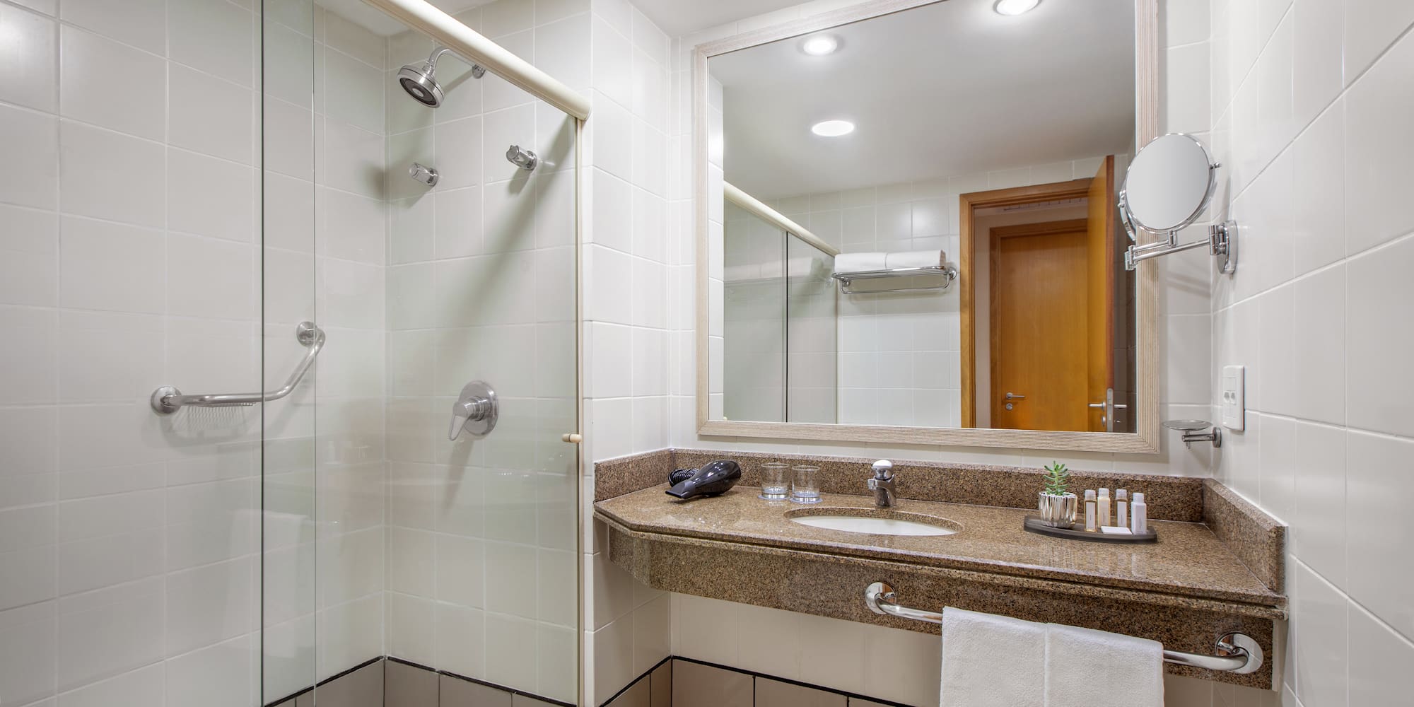 a bathroom with a shower and sink