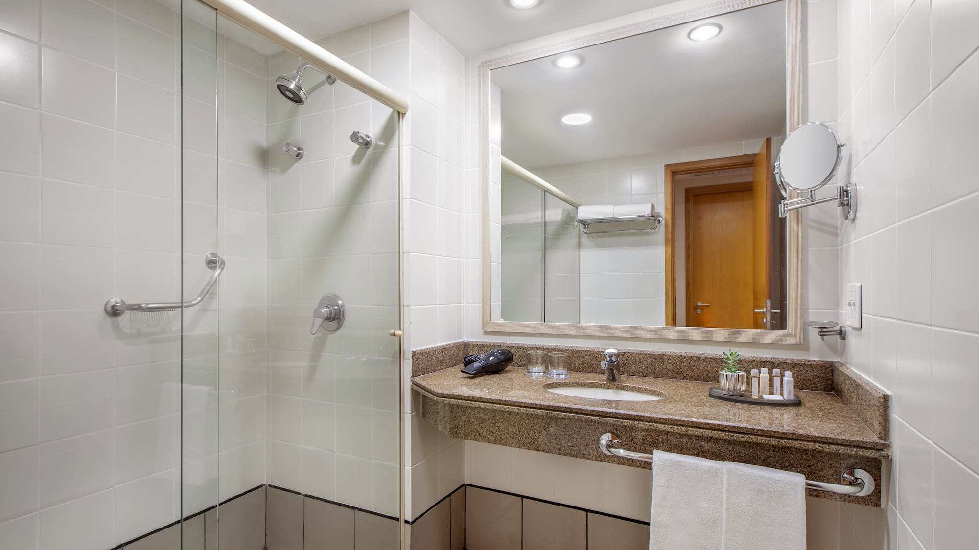 a bathroom with a shower and sink