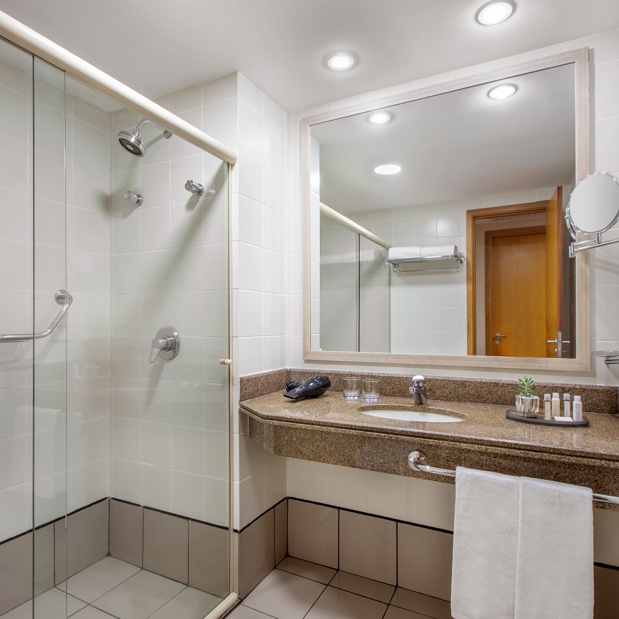 a bathroom with a shower and sink