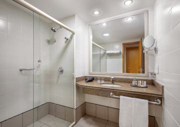 a bathroom with a shower and sink