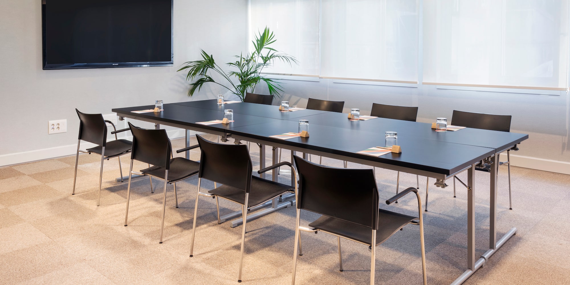 a conference room with a large table and chairs