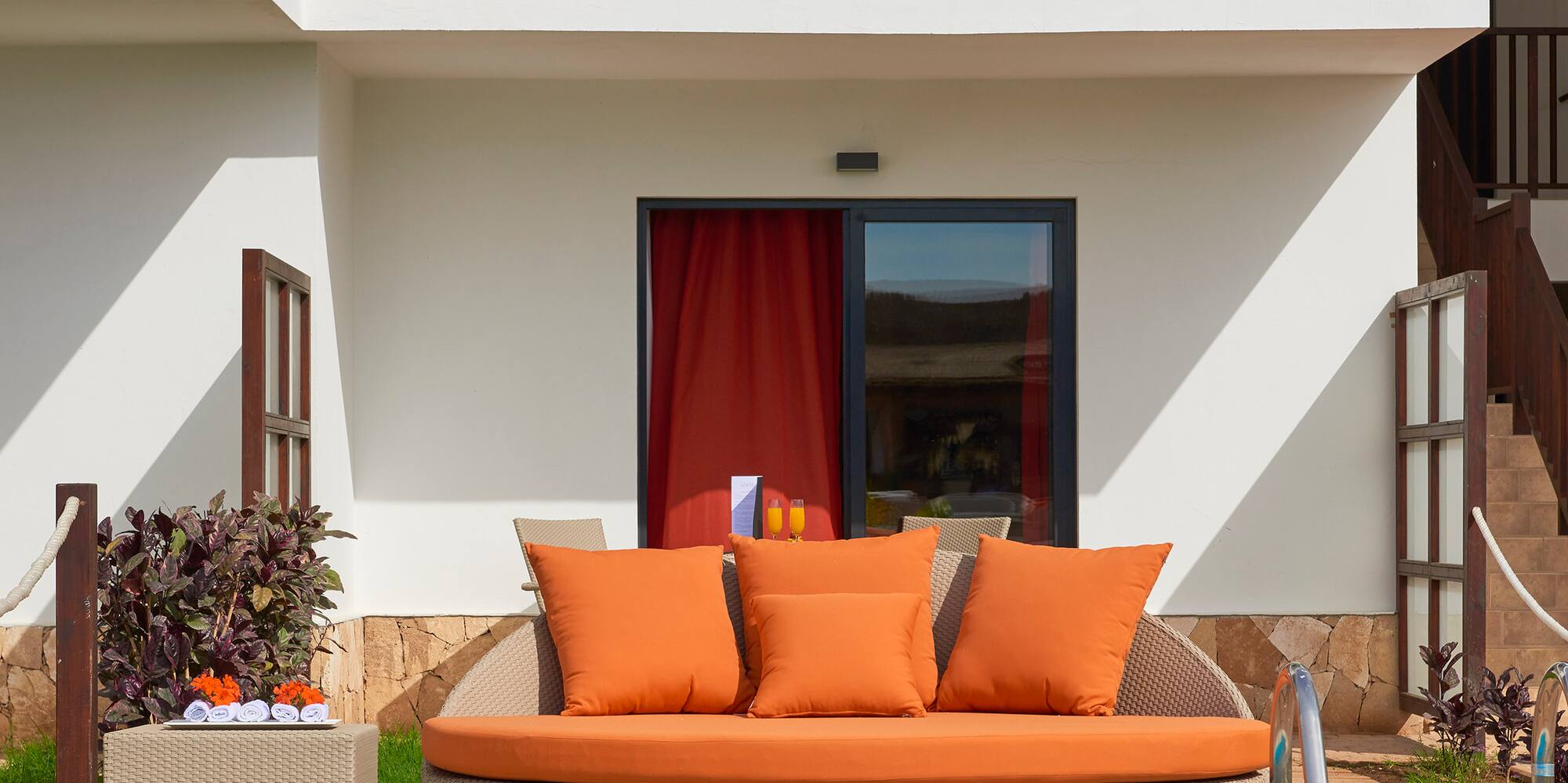 a pool with a couch and a table