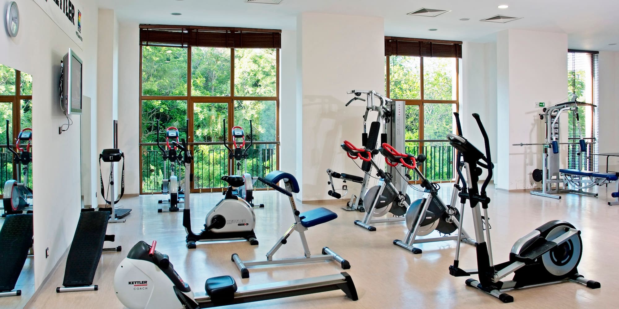 a room with exercise bikes and exercise equipment