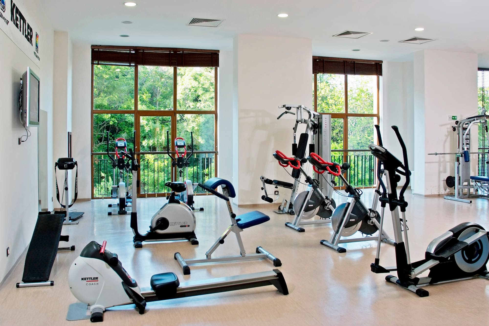 a room with exercise bikes and exercise equipment