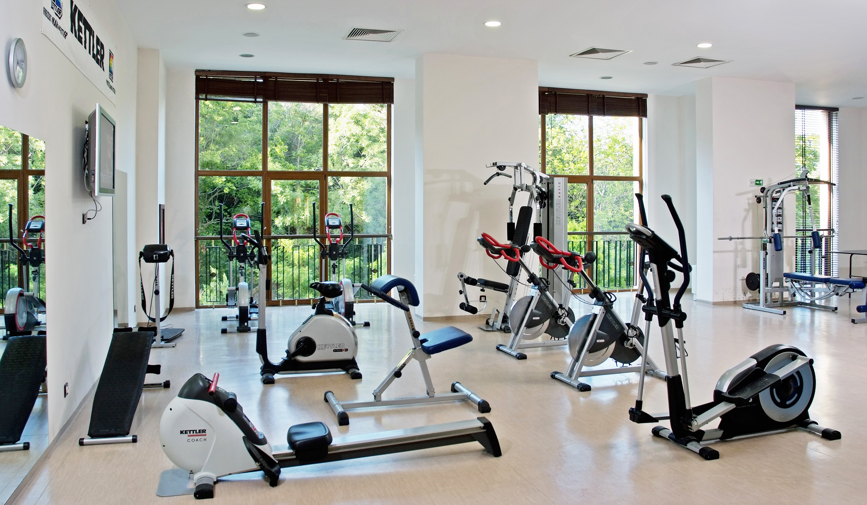 a room with exercise bikes and exercise equipment