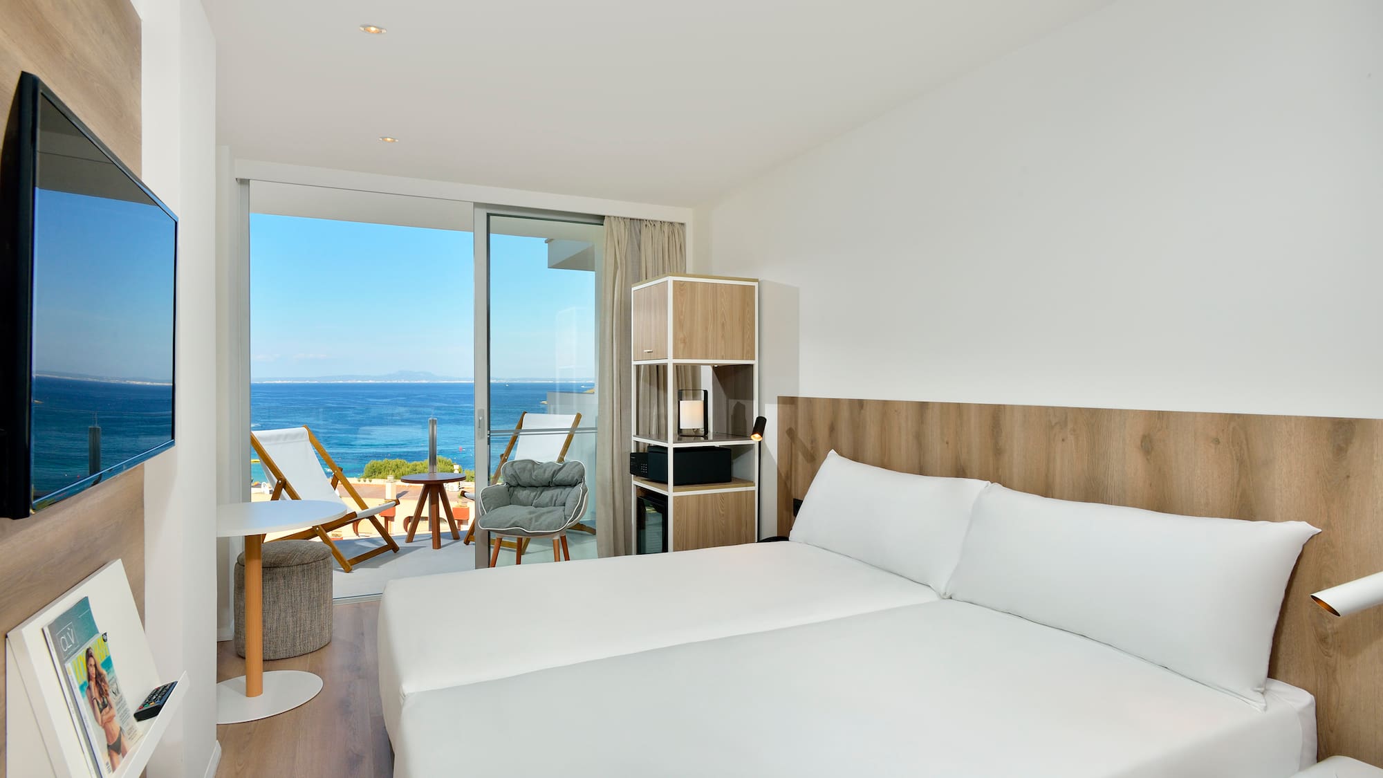 a room with a large bed and a glass door