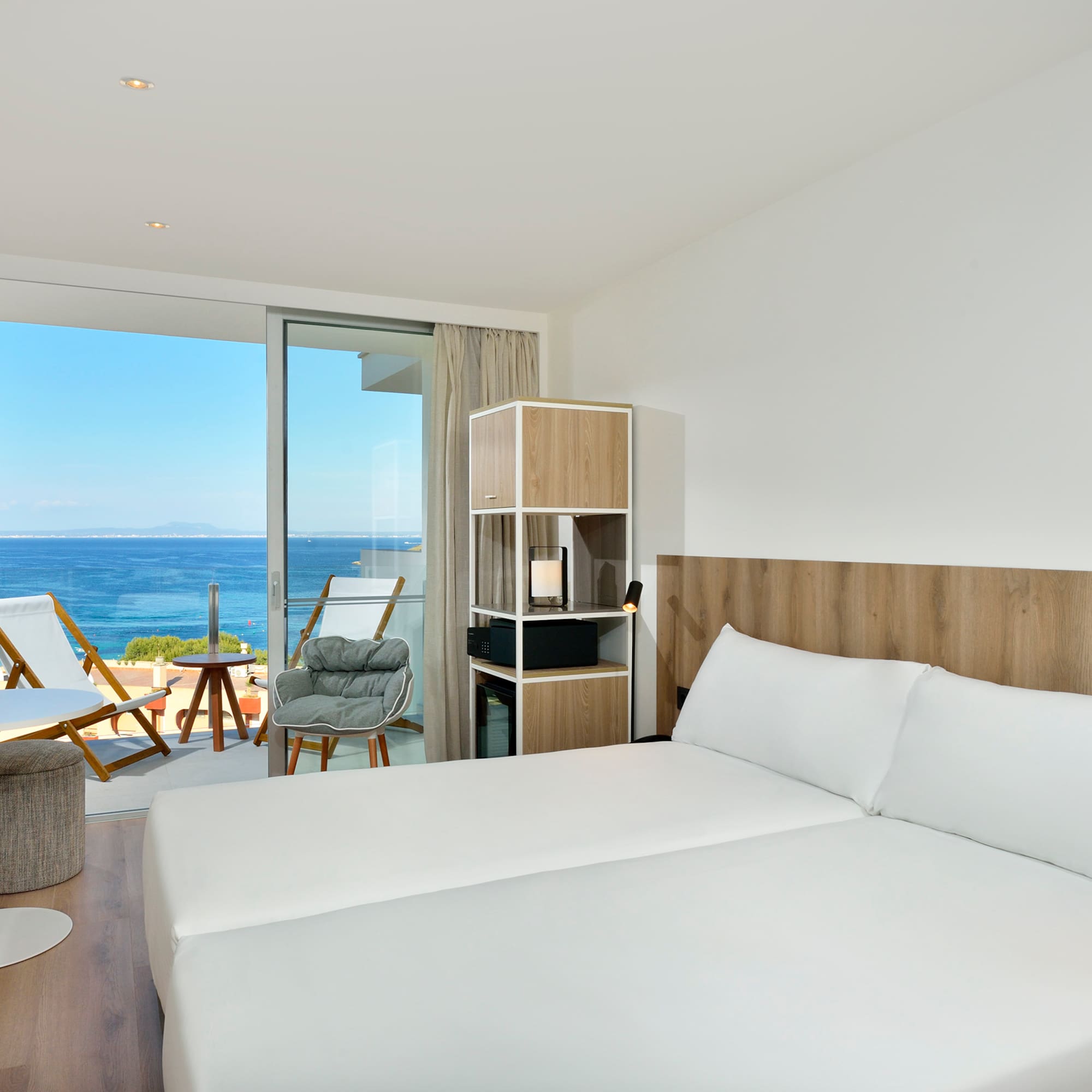 a room with a large bed and a glass door