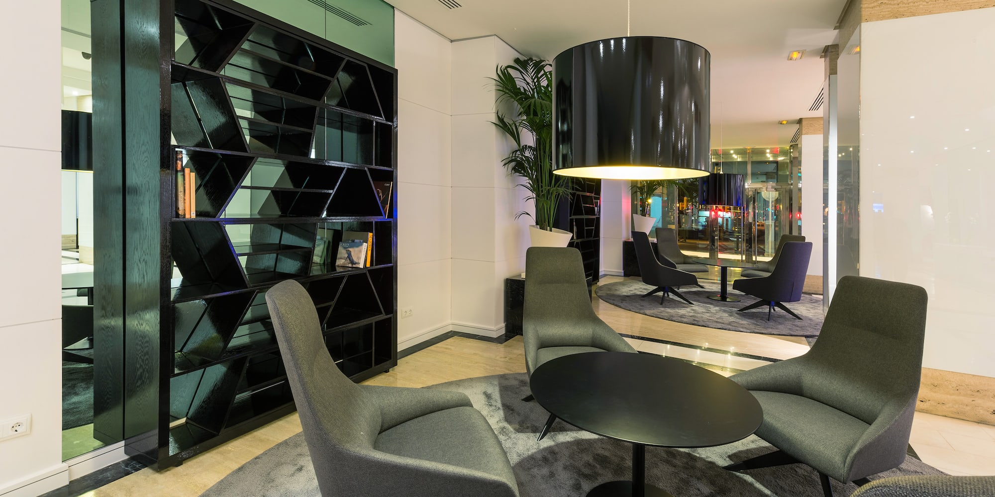 a room with a round table and chairs