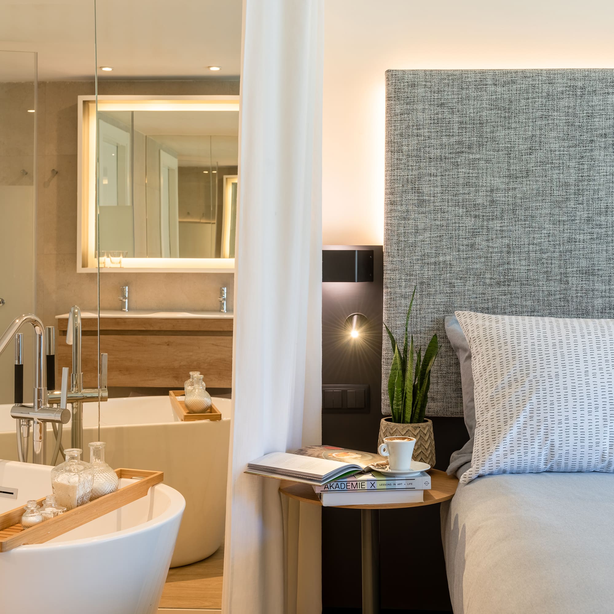 a bedroom with a bed and a bathtub