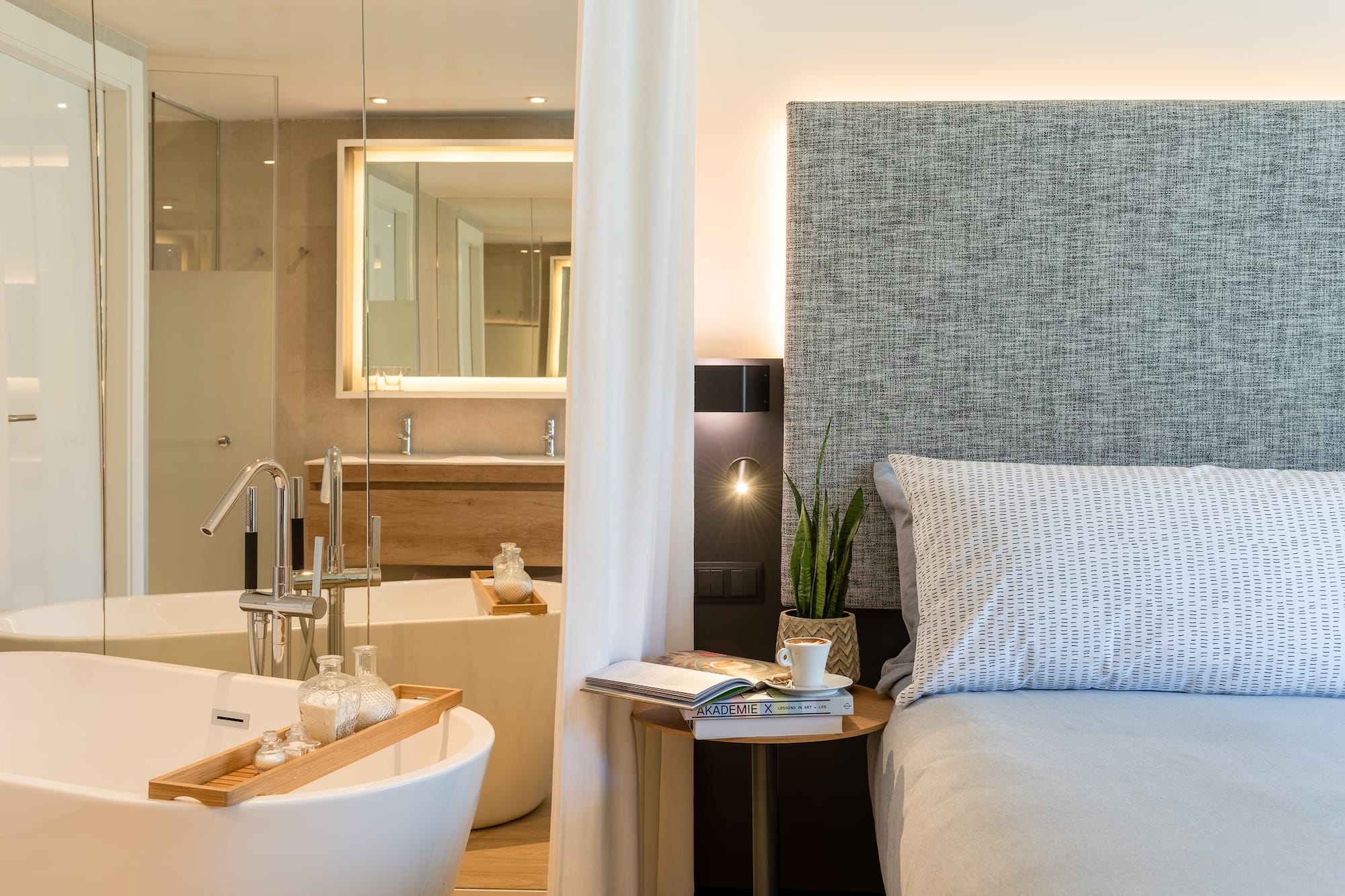 a bedroom with a bed and a bathtub