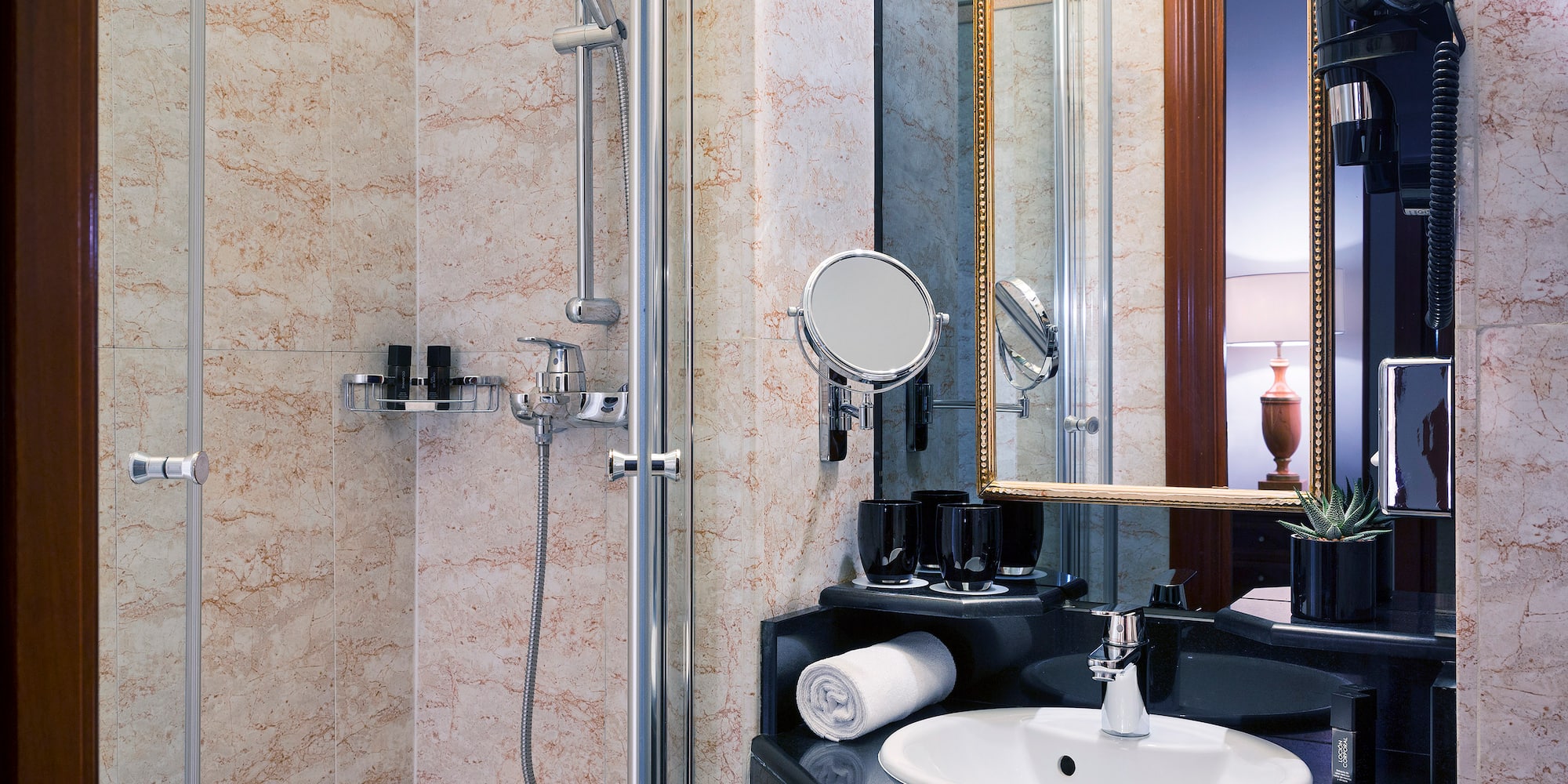 a bathroom with a shower and sink