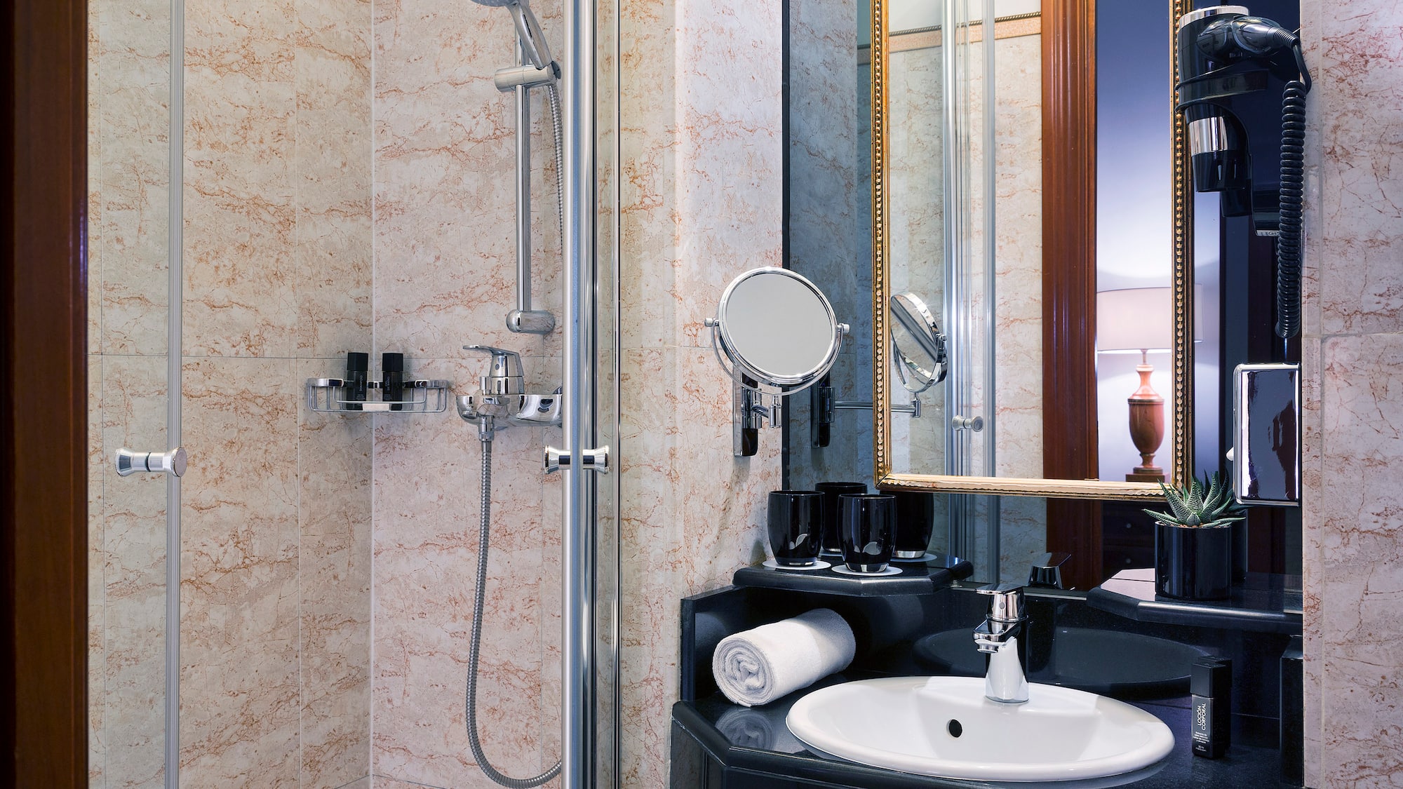 a bathroom with a shower and sink