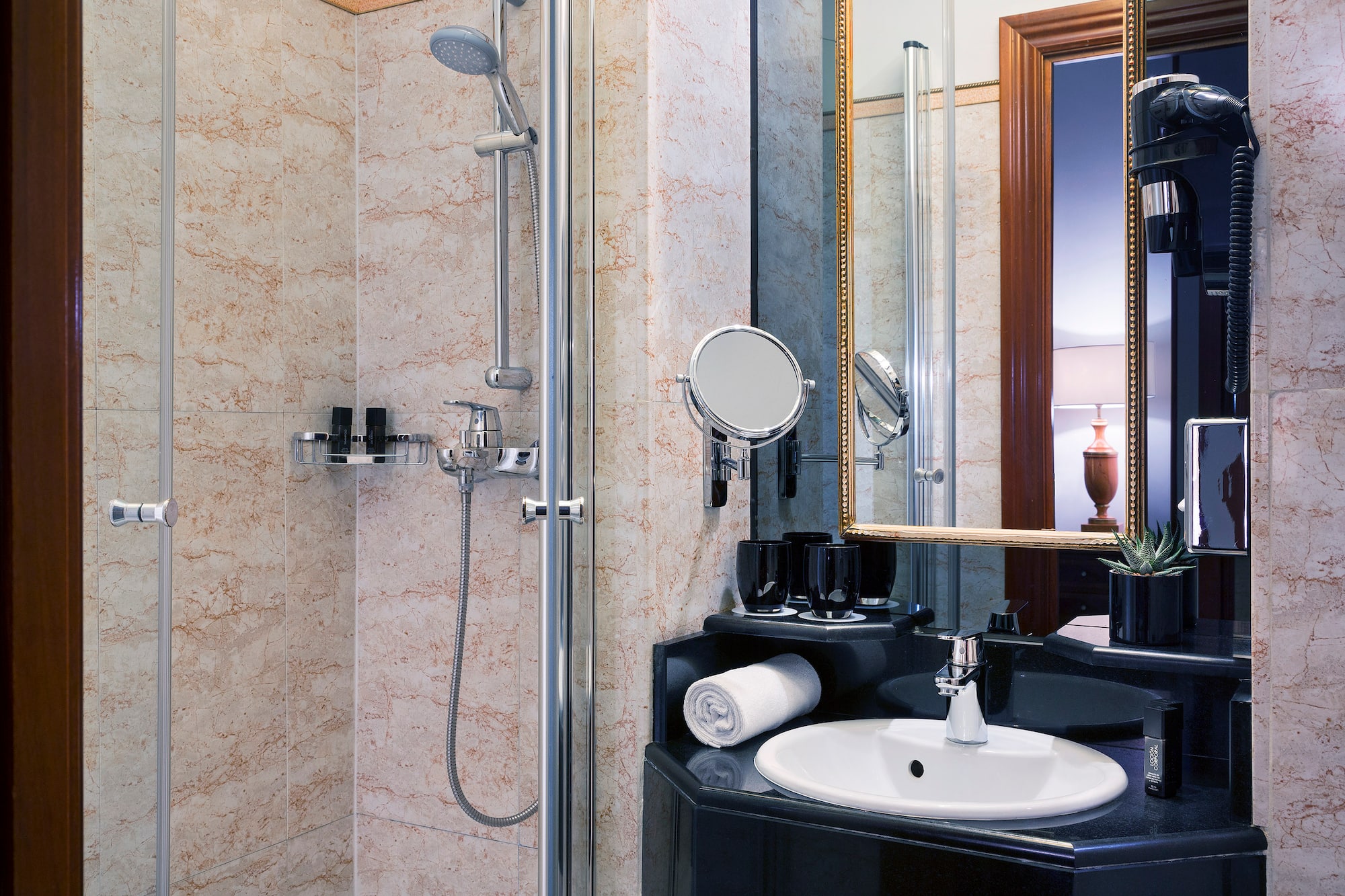 a bathroom with a shower and sink