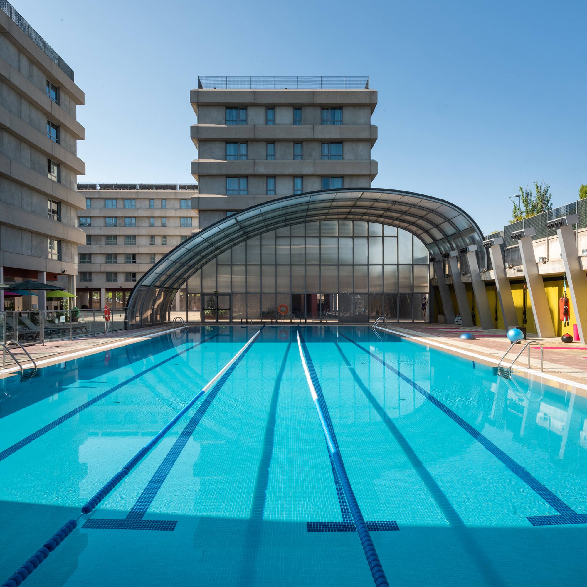 a swimming pool with a covered roof