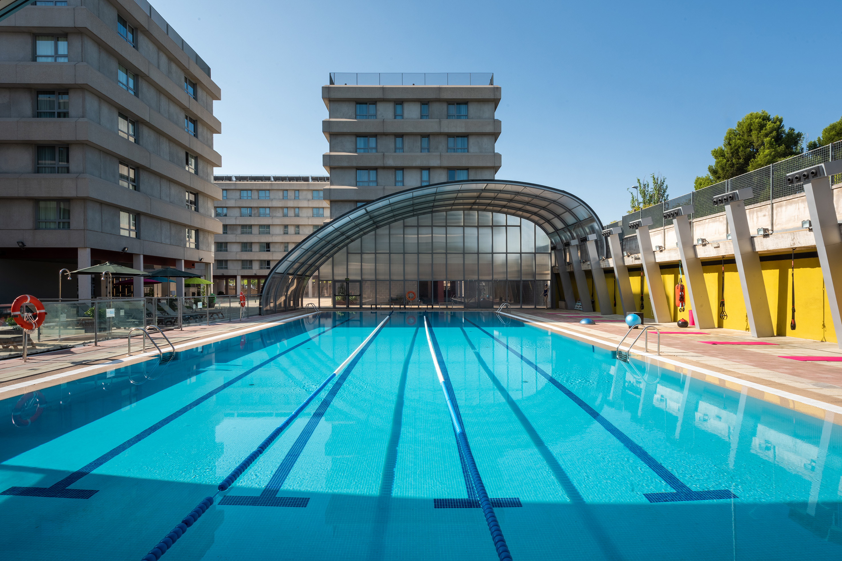 a swimming pool with a covered roof
