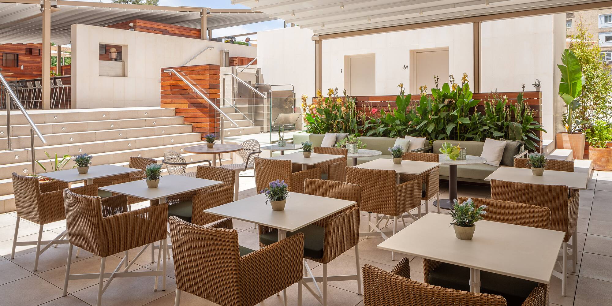 a patio with tables and chairs