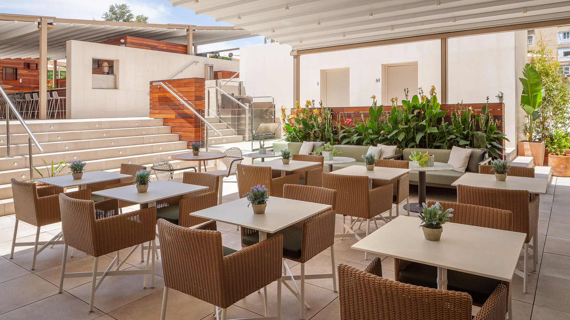 a patio with tables and chairs