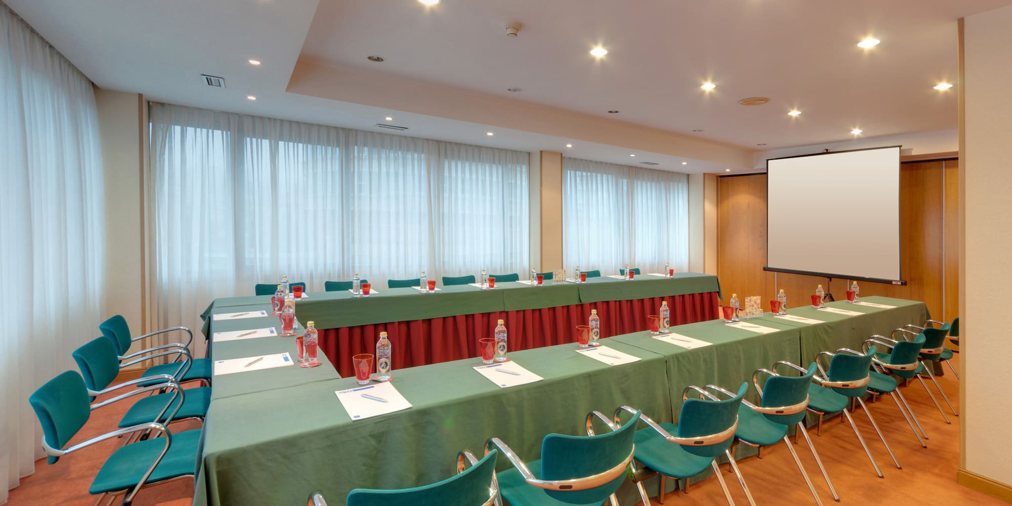 a long conference room with tables and chairs