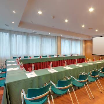 a long conference room with tables and chairs