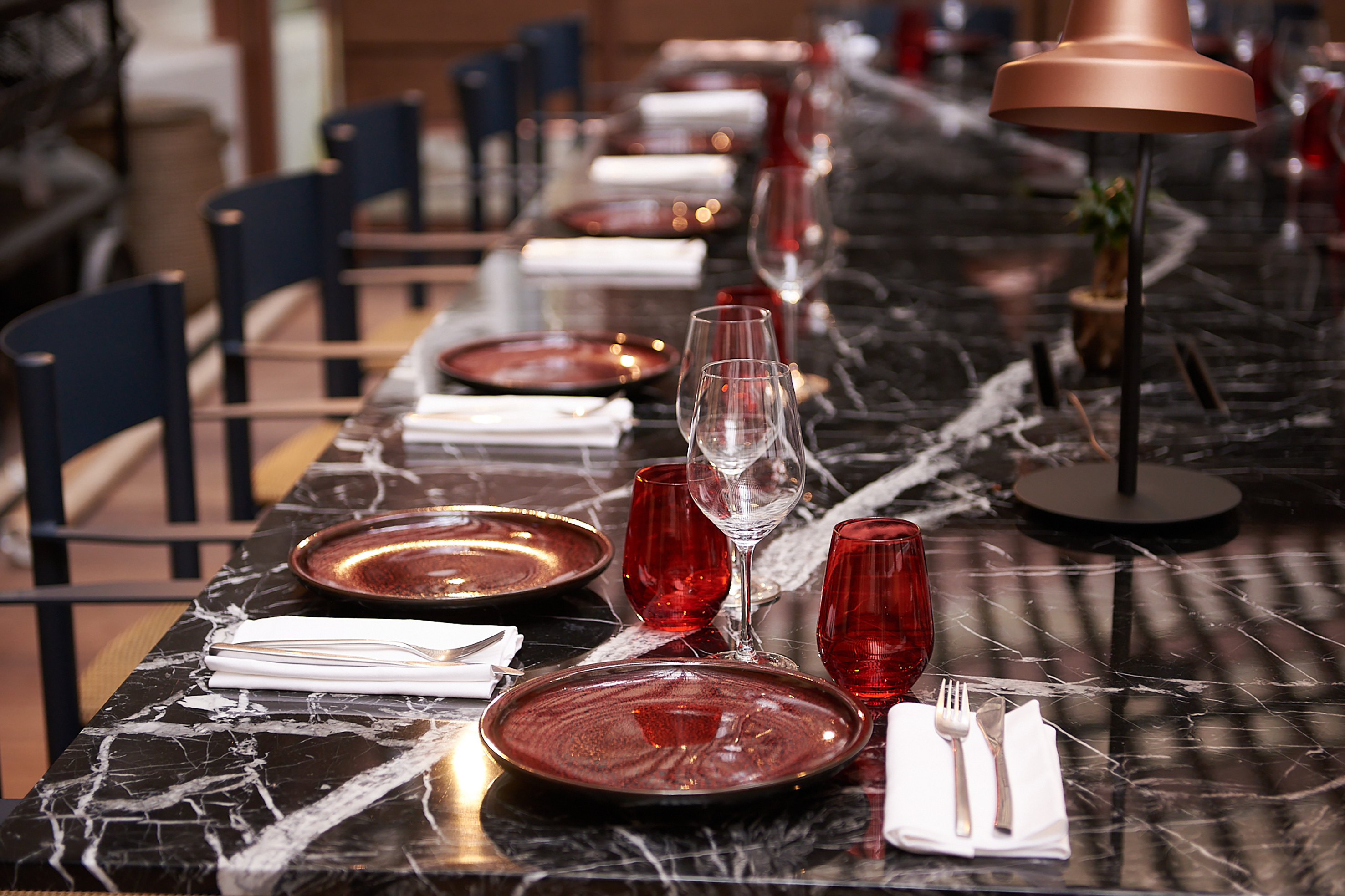 a long table with plates and glasses