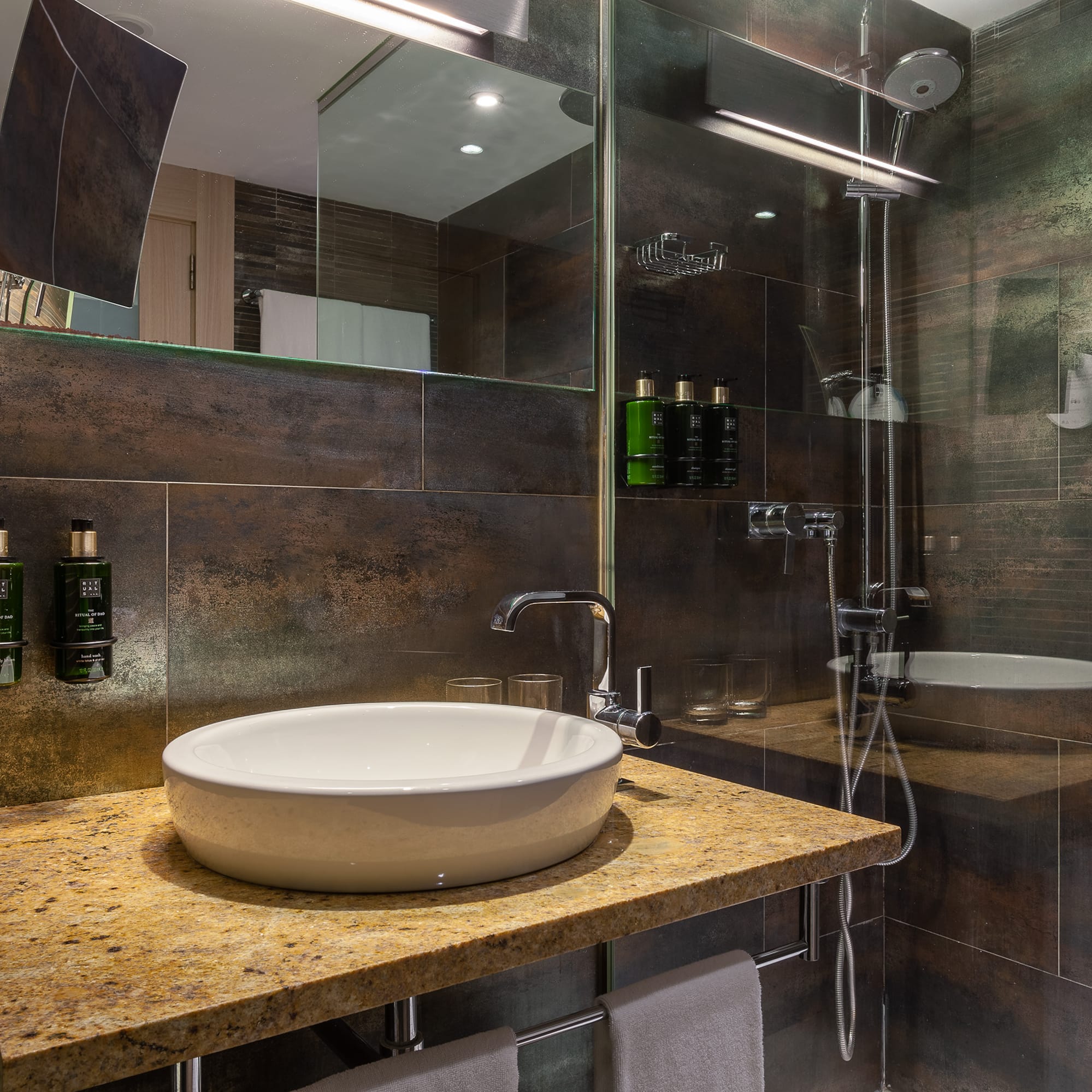 a bathroom with a sink and shower