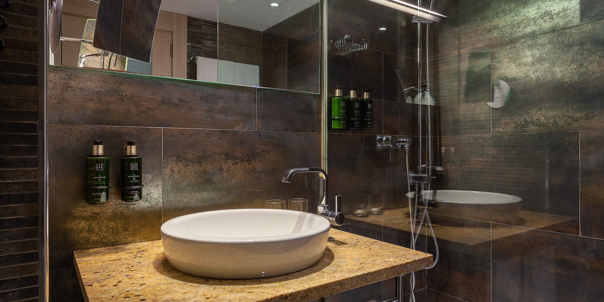 a bathroom with a sink and shower