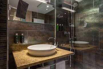 a bathroom with a sink and shower