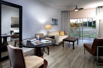 a living room with a table and chairs