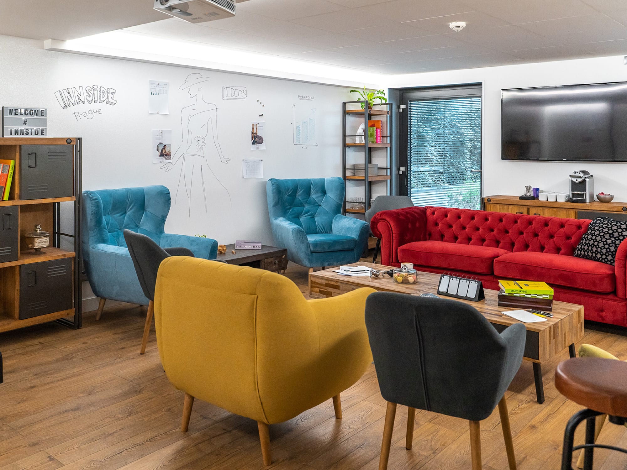 a room with a couch and chairs