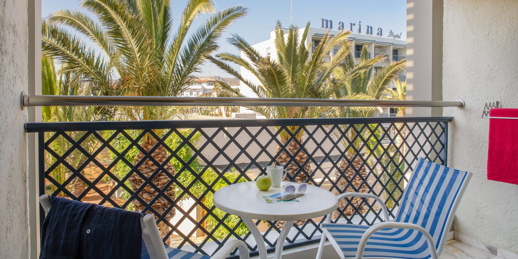 a chair and table on a balcony