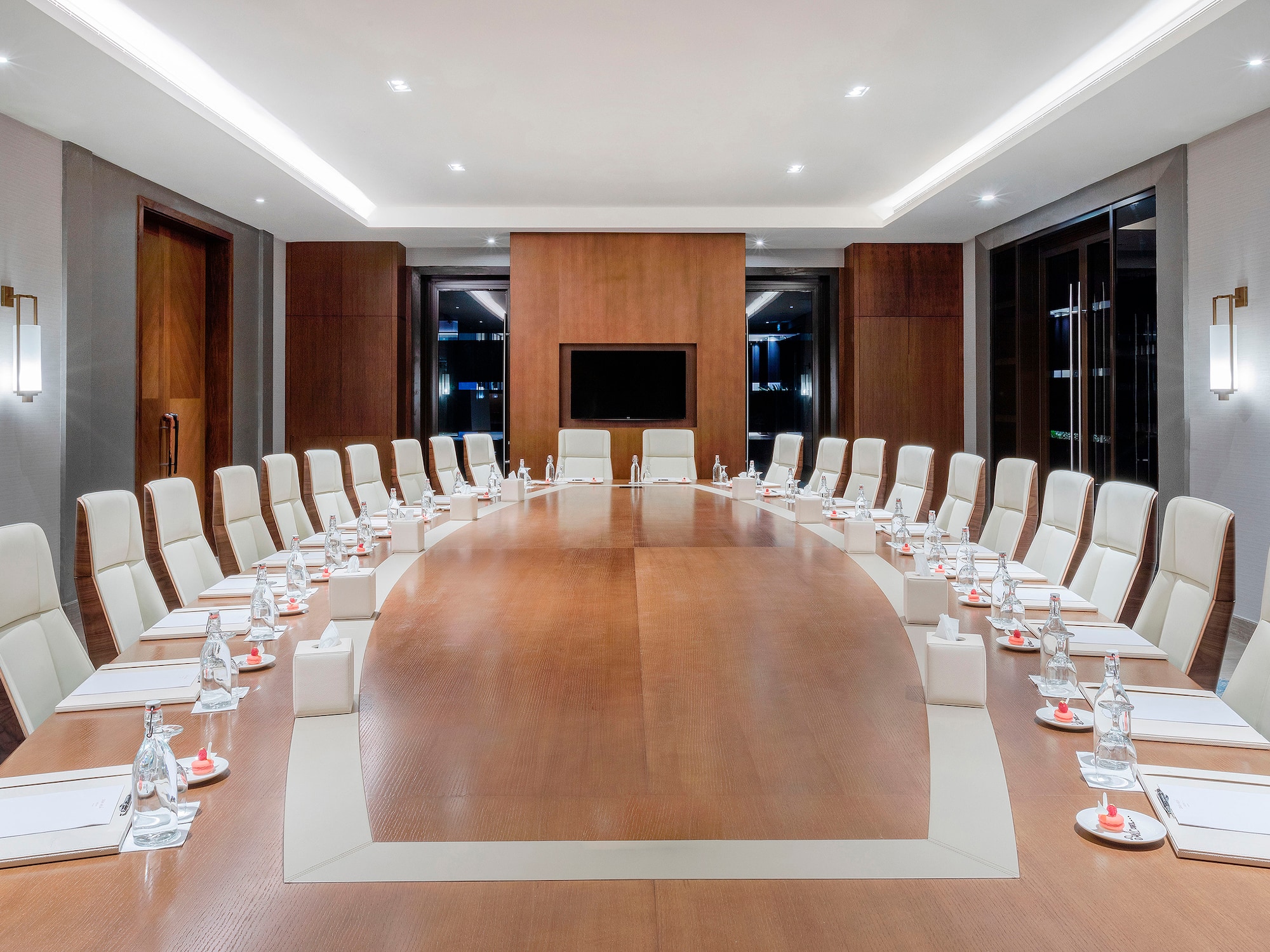 a conference room with a table and chairs.