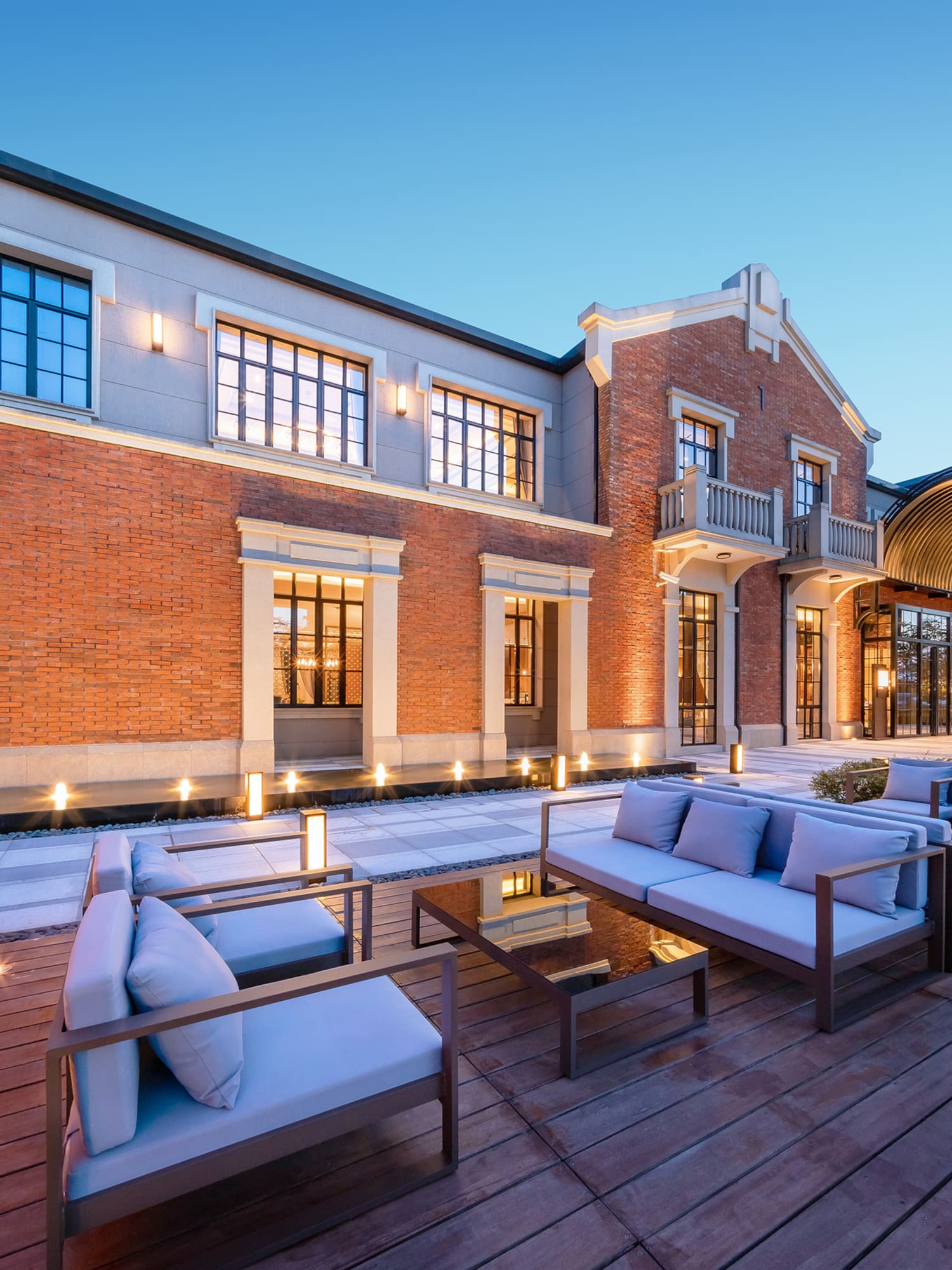a building with a patio and chairs