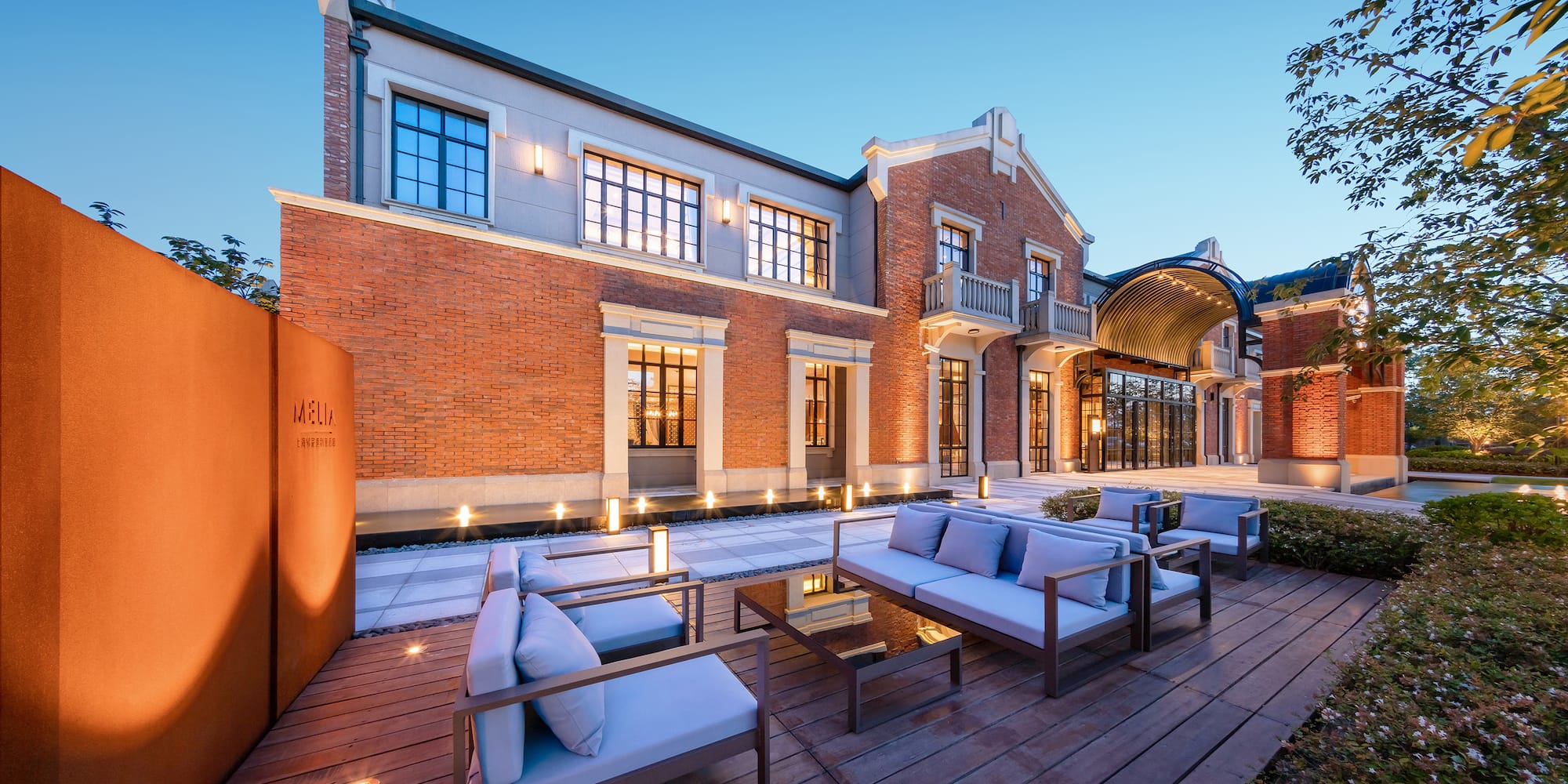 a building with a patio and chairs