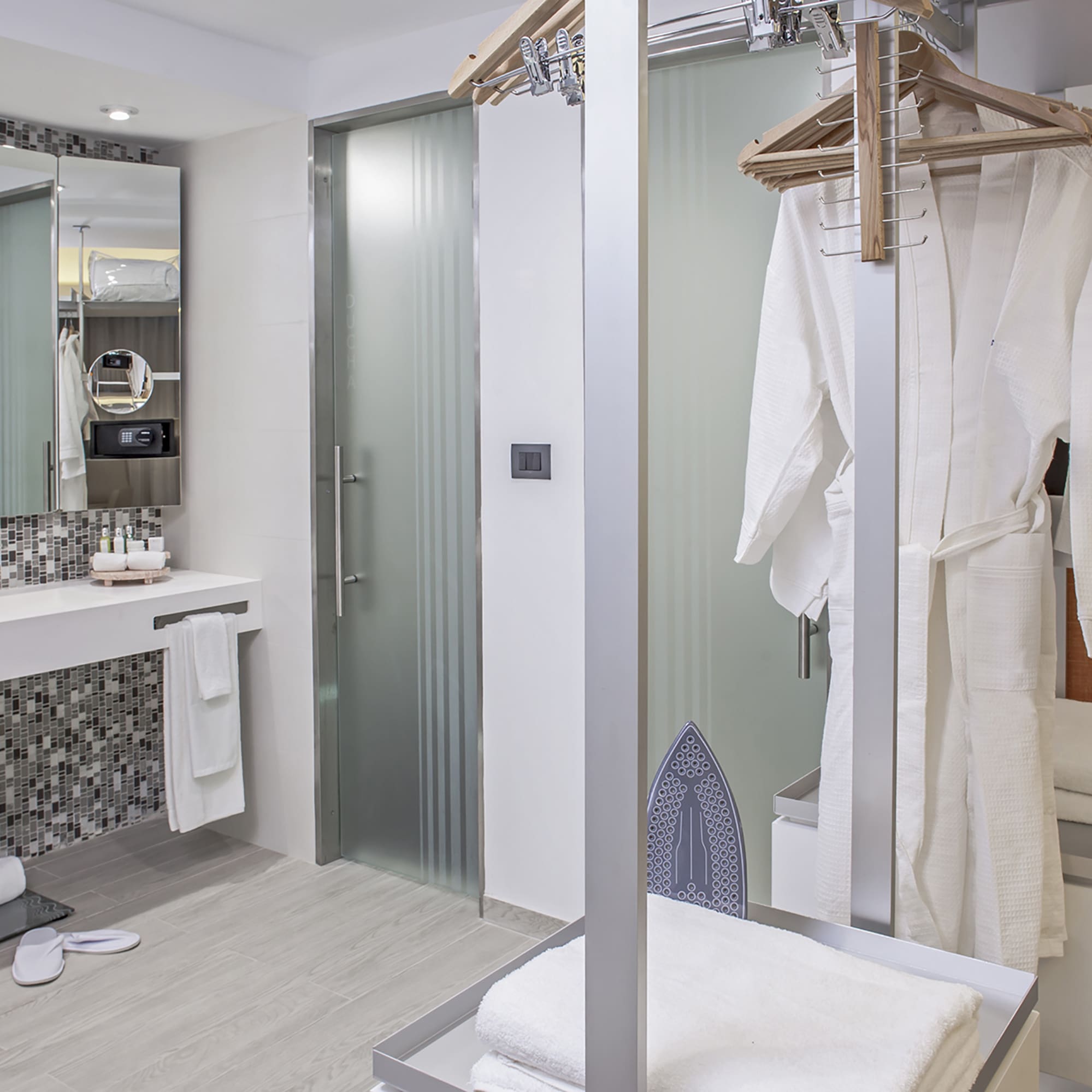 a bathroom with a shower and a towel rack