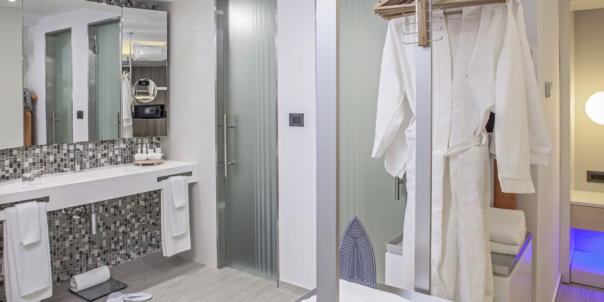a bathroom with a shower and a towel rack