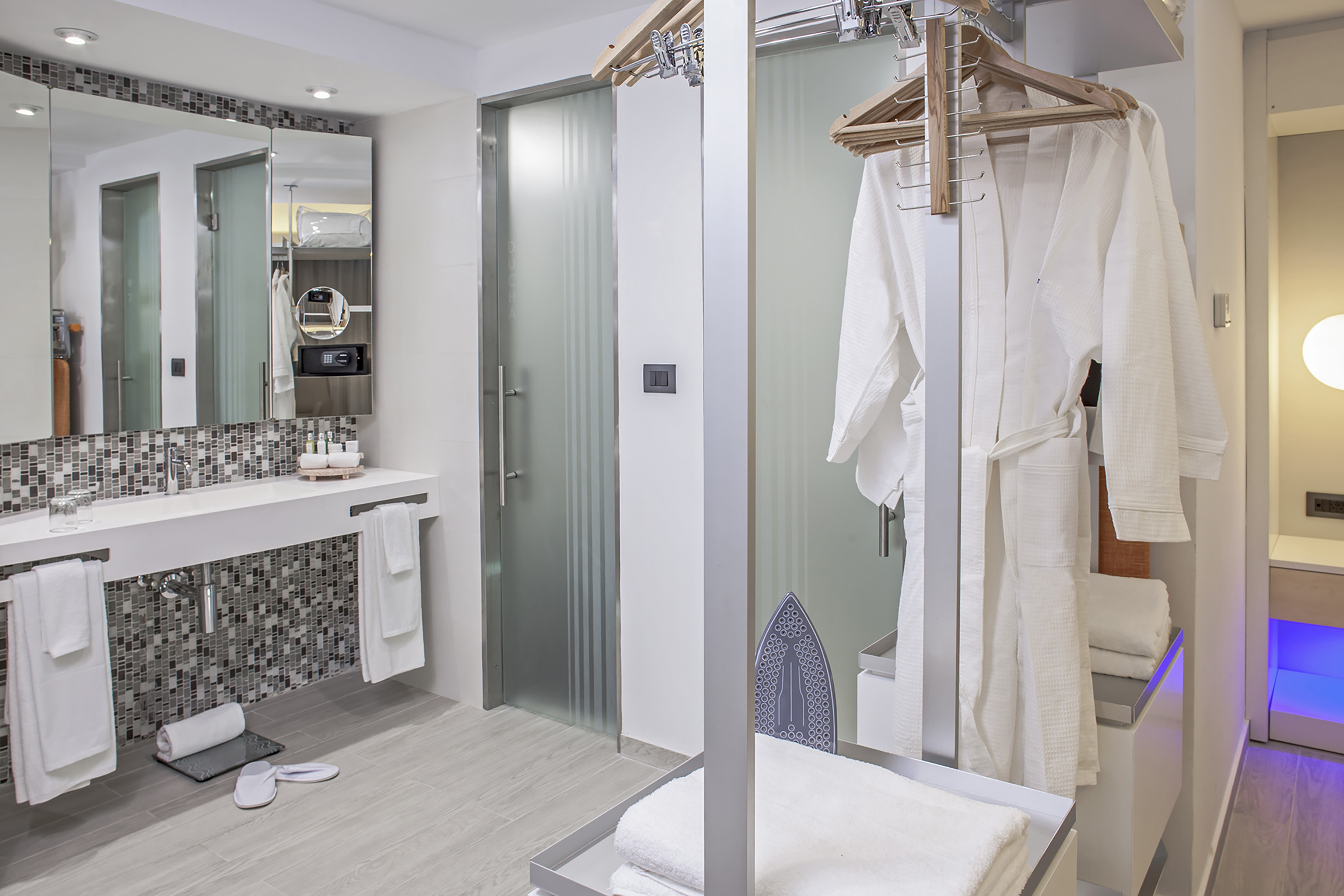 a bathroom with a shower and a towel rack