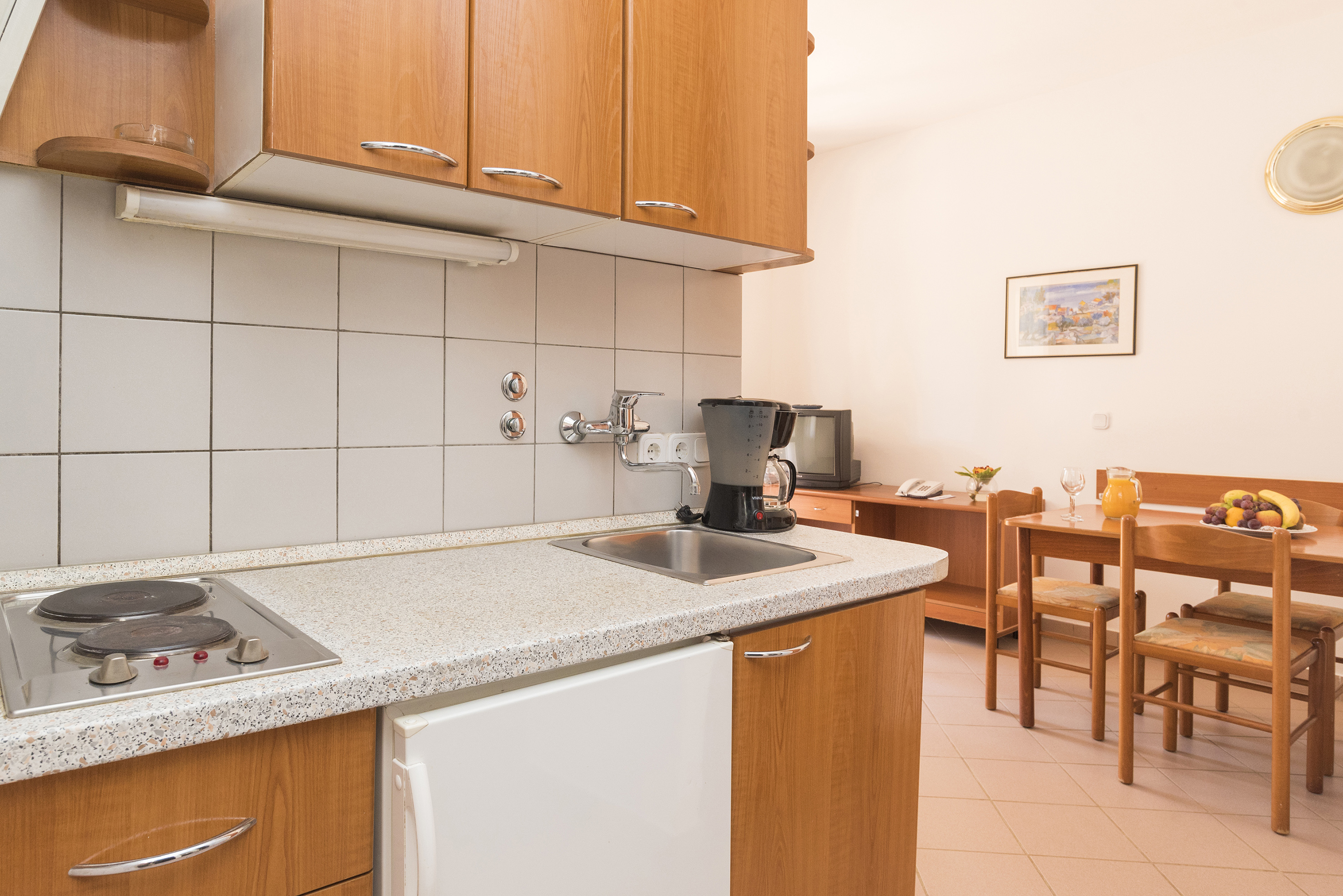 a kitchen with a table and chairs