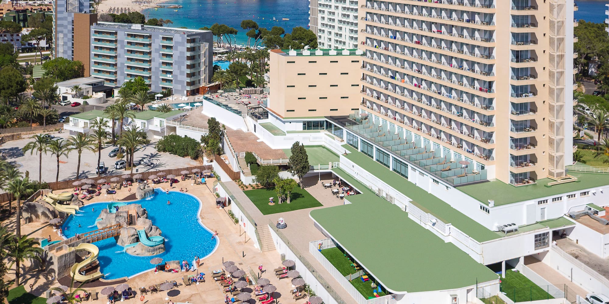 a large hotel with a pool and water park