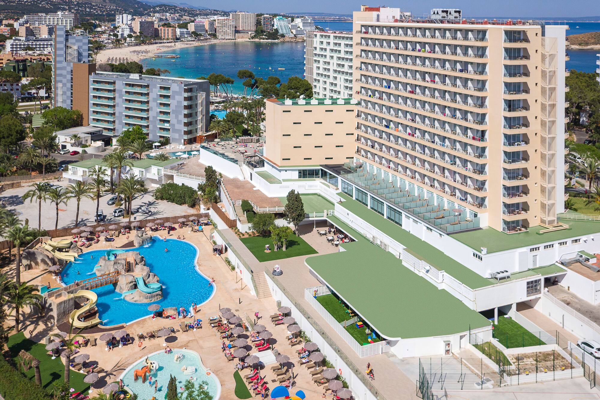 a large hotel with a pool and water park